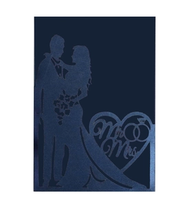 Detail of laser-cut wedding invitation featuring a groom and bride silhouette with Mr. & Mrs. text