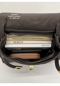 Top view of open tote bag showing spacious interior with books and zipper pocket