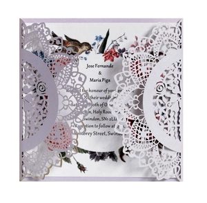 Detail of laser-cut lavender wedding invitation with floral and bird printed insert card