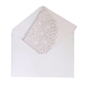 Laser-cut white pearlescent wedding invitation with elegant lace pattern and envelope