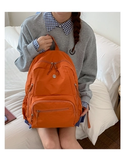 Hellorangener wasserdichter Nylon-Rucksack mit vielen praktischen Reißverschlussfächern