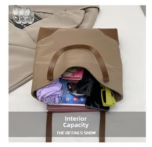 Top view of large khaki tote bag showing spacious interior with tablet and umbrella