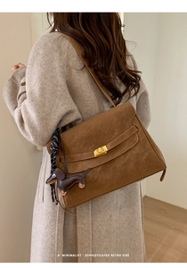 Brown faux suede retro satchel with gold twist lock and dachshund leather pendant