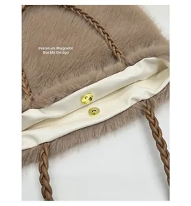Close-up of brown plush tote bag featuring a golden magnetic clasp and woven shoulder strap
