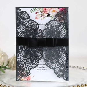 Elegant laser cut wedding invitation with black lace sleeve and pink floral insert