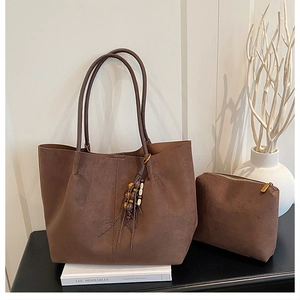 Brown suede tote bag set with matching zipper pouch and wooden bead tassel detail