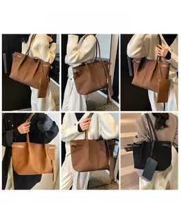 Detail view of large faux suede tote bag with detachable pouch in three classic colors
