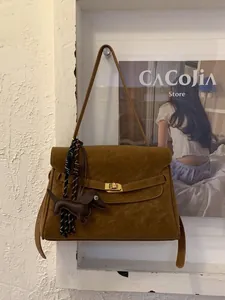 Retro brown suede tote bag with golden twist lock and brown dog leather charm