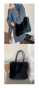 Detail of fluffy black faux fur tote bag with sturdy woven handles and large capacity