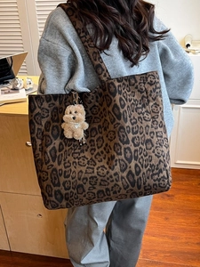 Chic leopard print tote bag in velvet suede fabric with a cute plush puppy pendant