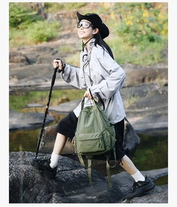 Detail of army green large capacity outdoor backpack used for hiking and trekking