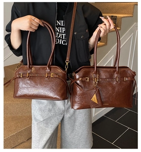 Comparison of large and small dark brown vintage tote bags in polished leather with gold hardware