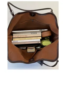 Top view of spacious tote bag interior with multiple compartments and magnetic closure