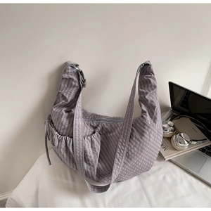 Purple gingham hobo bag detail with side drawstring pocket and adjustable wide strap