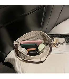 Close-up of canvas tote bag interior showing large capacity for tablet and daily items