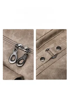 Detailed macro view of heavy-duty canvas bag featuring dual metal zippers and rivets