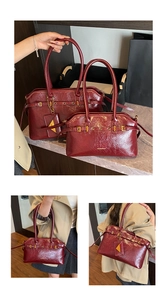Detail of glossy burgundy tote bags featuring metallic buckles and wax leather texture