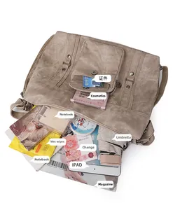 Interior view showing the large capacity and multiple compartments of the khaki tote bag