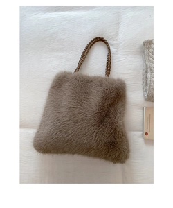 Detailed close-up of brown plush tote bag with woven rope handle and soft faux fur texture