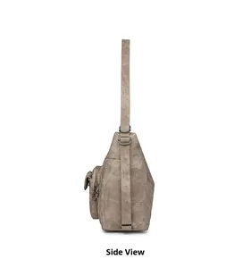 Side view of khaki faux leather shoulder bag featuring multi-layered zipper pockets