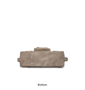 Flat bottom view of a vintage brown leather tote bag with clear reinforced stitching