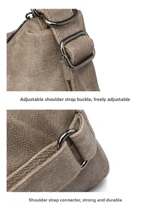 Detail of adjustable gunmetal buckle and reinforced stitching on brown canvas tote bag