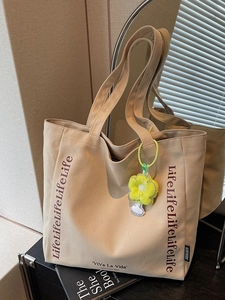 Beige large capacity canvas tote bag with letter print and yellow flower charm decoration