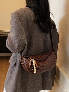 Fashionable dark brown woven crossbody dumpling bag with a retro crescent moon shape