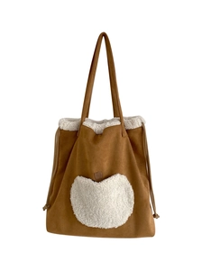 Brown suede tote bag with white fleece trim and a heart-shaped fuzzy pocket for autumn