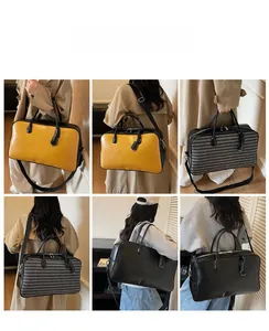 Détail du grand sac cabas polyvalent disponible en coloris jaune et gris-noir