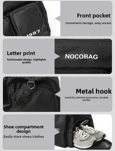 Detail view of the black travel bag showing durable metal hooks and separate shoe compartment