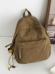 Minimalist khaki large-capacity nylon backpack with decorative plush pendant for women