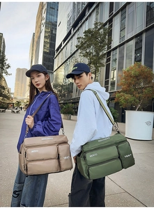 Dual models showcase army green and khaki multi-pocket waterproof nylon travel bags in city