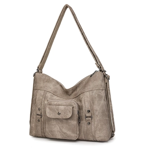 Detailed close-up of retro khaki shoulder bag with vintage rivets and zipper texture