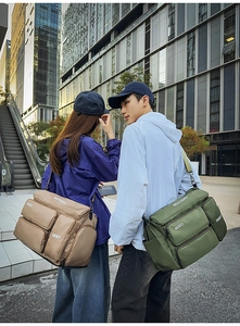 Outdoor shot of large capacity travel duffel bags with adjustable straps in khaki and green