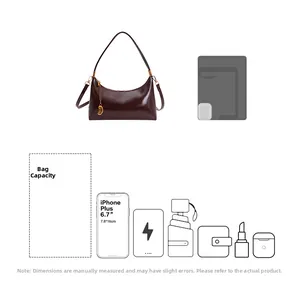 Detailed interior storage view of glossy burgundy underarm bag with daily essentials
