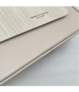 Detail of the woven texture and beige leather stitching on this stylish shoulder bag