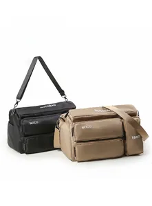 Macro shot of nylon multifunctional travel bags in black and khaki with multi-zipper pockets