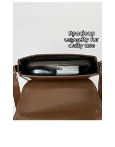 Interior view of small vintage brown saddle bag showing space for phone and essentials
