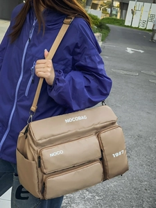 Multifunctional khaki outdoor travel bag with large capacity and multiple pockets