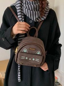 Brown faux suede mini backpack with cat embroidery and adjustable shoulder straps
