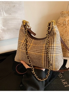 Elegant tweed houndstooth crossbody bag with gold chain and adjustable leather strap
