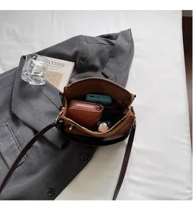 Spacious interior of brown square bag showing ample storage for daily essentials