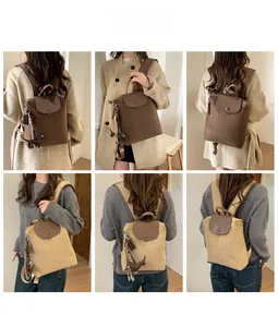 Detail shots of large nylon backpack in brown and khaki with cute dog charm