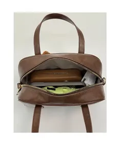 Top-down view of a brown leather bag showing spacious capacity for daily essentials