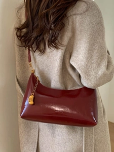 Retro deep red glossy leather baguette bag with gold metal pendant for women
