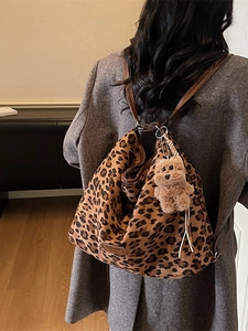 Canvas leopard print bucket bag with brown leather strap and cute bear charm pendant