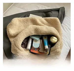 Internal view of beige faux shearling tote bag showing large capacity for daily items