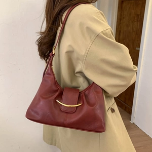 Burgundy faux leather crescent shoulder bag with golden metallic hardware detail