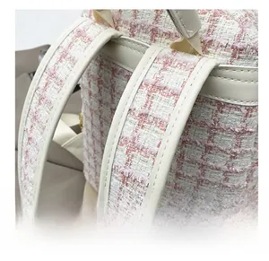 Close-up of comfortable pink tweed shoulder straps with elegant sequin texture details